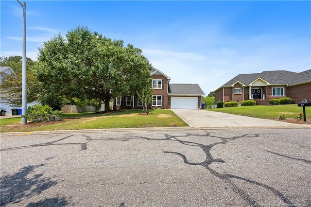 3517 Gables Dr, Fayetteville, NC 28311 - view of front of house with a garage, driveway, and brick siding