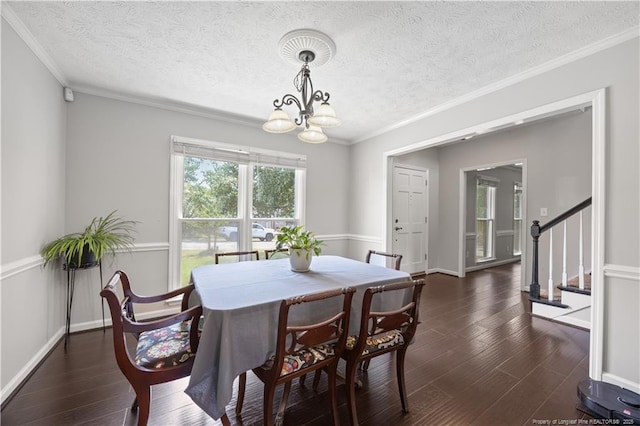 3517 Gables Dr, Fayetteville, NC 28311 - dining room with a chandelier, a textured ceiling, dark wood-style floors, ornamental molding, and stairway