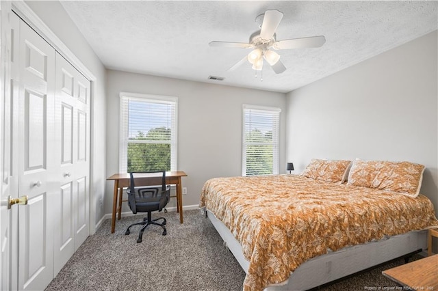 3517 Gables Dr, Fayetteville, NC 28311 - carpeted bedroom with baseboards, a textured ceiling, ceiling fan, and a closet