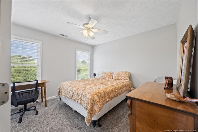 3517 Gables Dr, Fayetteville, NC 28311 - bedroom featuring a textured ceiling, carpet flooring, ceiling fan, a desk, and baseboards