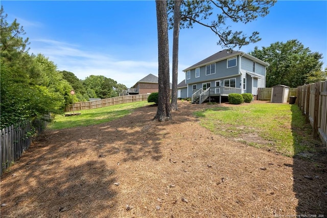 3517 Gables Dr, Fayetteville, NC 28311 - rear view of property featuring a fenced backyard and stairway