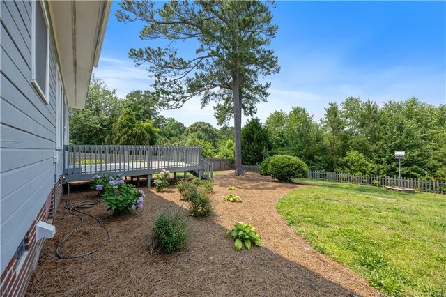 3517 Gables Dr, Fayetteville, NC 28311 - view of yard with a deck and view of wooded area