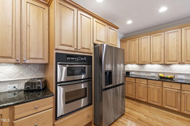 1831 Middlebrook Dr, Raleigh, NC 27615 - kitchen featuring stainless steel appliances, ornamental molding, decorative backsplash, dark stone countertops, and light wood-style flooring