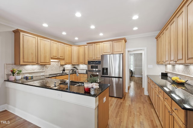 1831 Middlebrook Dr, Raleigh, NC 27615 - kitchen featuring stainless steel appliances, a peninsula, tasteful backsplash, recessed lighting, and ornamental molding