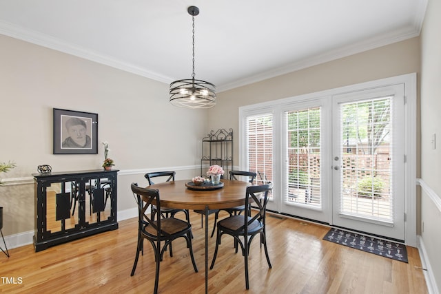 1831 Middlebrook Dr, Raleigh, NC 27615 - dining room with light wood-type flooring, crown molding, and a chandelier