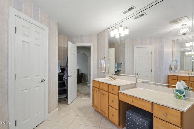 1831 Middlebrook Dr, Raleigh, NC 27615 - full bath with wallpapered walls, tile patterned floors, vanity, and a chandelier