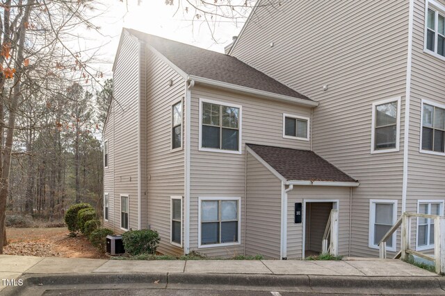6131 Summerpointe Pl Unit 101, Raleigh, NC 27606 - view of front of house with a shingled roof