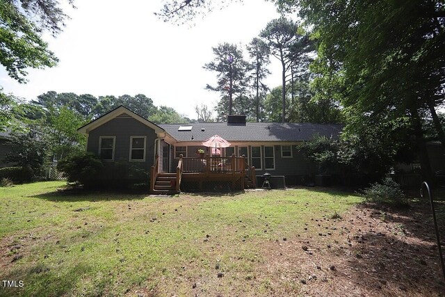 6717 Valley Dr, Raleigh, NC 27612 - rear view of house with a deck and a lawn