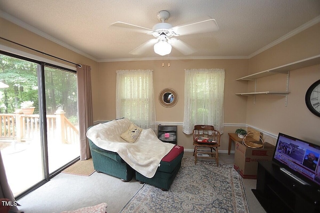 6717 Valley Dr, Raleigh, NC 27612 - sitting room featuring a textured ceiling, ornamental molding, a ceiling fan, and carpet