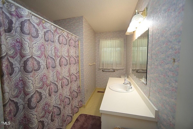 6717 Valley Dr, Raleigh, NC 27612 - bathroom with vanity, wallpapered walls, and a shower with curtain