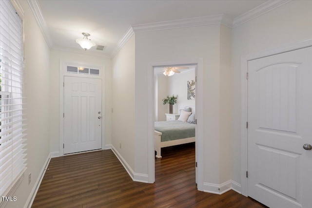 531 Finnbar Dr, Cary, NC 27519 - entrance foyer featuring dark wood finished floors and ornamental molding