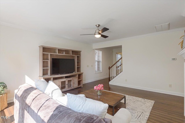 531 Finnbar Dr, Cary, NC 27519 - living room with ceiling fan, wood finished floors, crown molding, and stairs