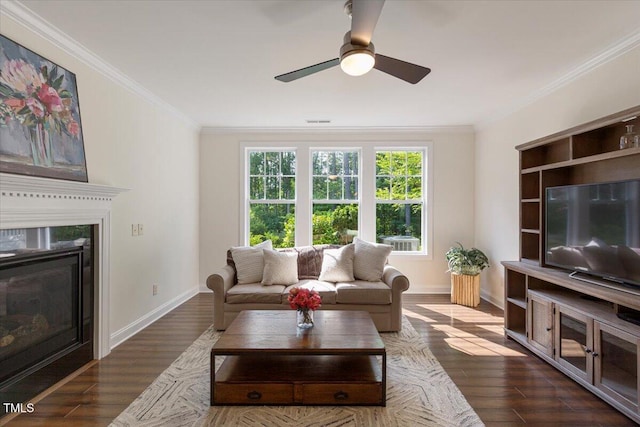 531 Finnbar Dr, Cary, NC 27519 - living area with ornamental molding, ceiling fan, wood finished floors, and a glass covered fireplace