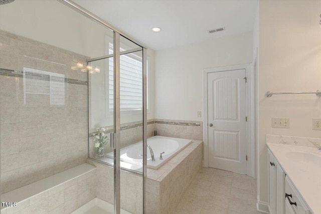531 Finnbar Dr, Cary, NC 27519 - full bath featuring a garden tub, vanity, a shower stall, tile patterned flooring, and recessed lighting