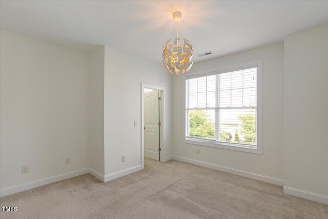 531 Finnbar Dr, Cary, NC 27519 - empty room with a chandelier and light colored carpet