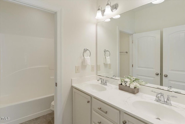 531 Finnbar Dr, Cary, NC 27519 - full bath featuring double vanity,  shower combination, and tile patterned floors