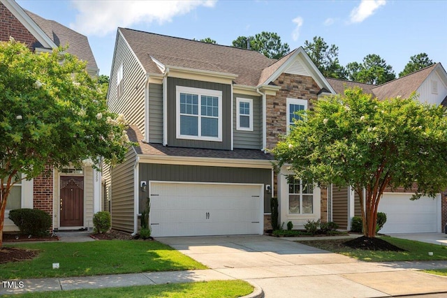 531 Finnbar Dr, Cary, NC 27519 - craftsman inspired home with stone siding, concrete driveway, an attached garage, a shingled roof, and board and batten siding