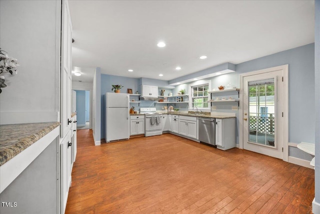1013 Oak Forest Dr NW, Wilson, NC 27896 - kitchen with white appliances, open shelves, light wood-style floors, white cabinetry, and recessed lighting