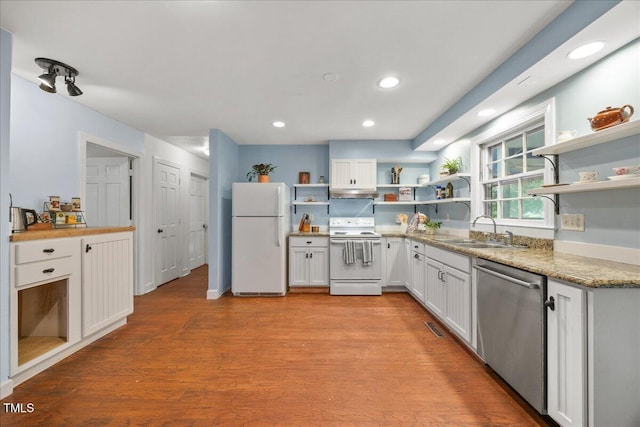 1013 Oak Forest Dr NW, Wilson, NC 27896 - kitchen with white appliances, open shelves, wood finished floors, white cabinets, and recessed lighting