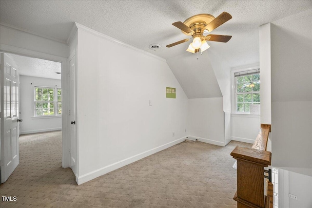 1013 Oak Forest Dr NW, Wilson, NC 27896 - bonus room with carpet, a textured ceiling, a ceiling fan, and vaulted ceiling