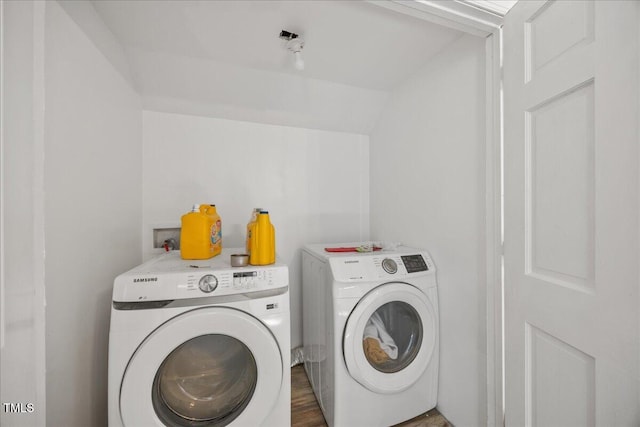 1013 Oak Forest Dr NW, Wilson, NC 27896 - washroom with separate washer and dryer and wood finished floors