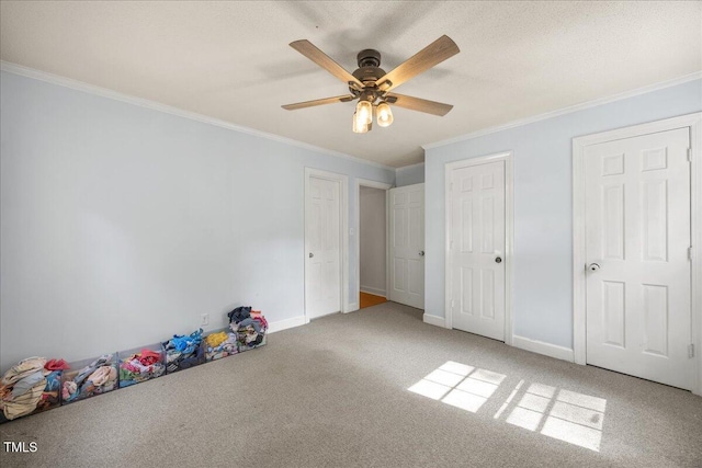 1013 Oak Forest Dr NW, Wilson, NC 27896 - unfurnished bedroom featuring crown molding, carpet, and a ceiling fan