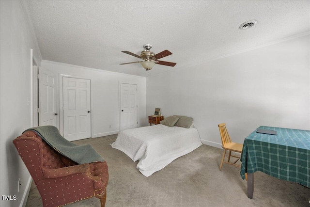 1013 Oak Forest Dr NW, Wilson, NC 27896 - carpeted bedroom with a textured ceiling, crown molding, and ceiling fan