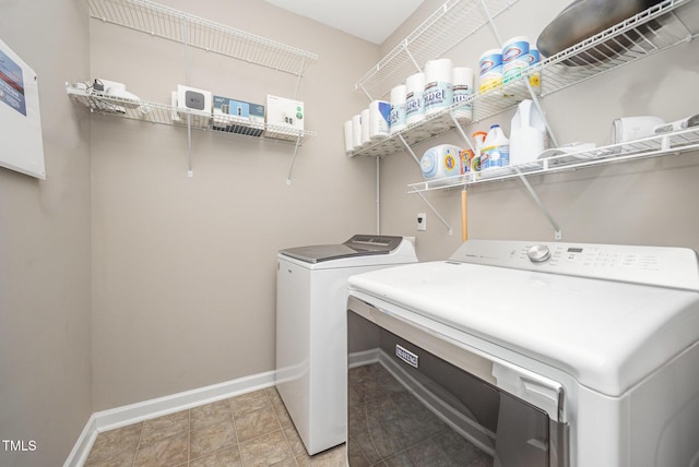 3037 Willow Ranch Dr, Fuquay Varina, NC 27526 - laundry area featuring washing machine and dryer and baseboards