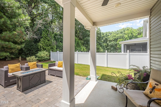 3037 Willow Ranch Dr, Fuquay Varina, NC 27526 - view of patio / terrace with ceiling fan and an outdoor living space with a fire pit