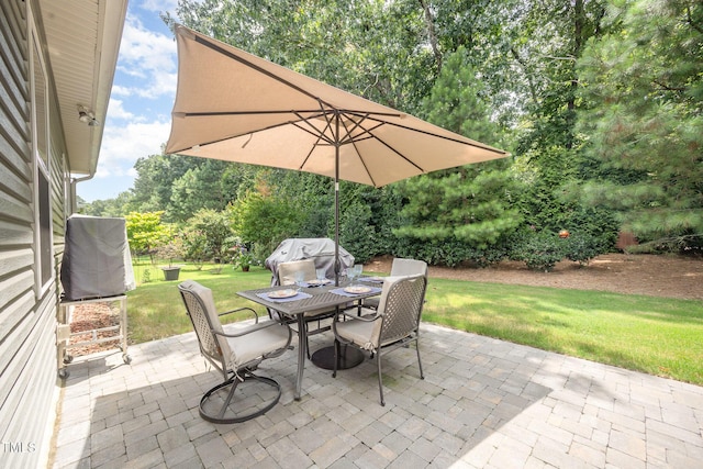 3037 Willow Ranch Dr, Fuquay Varina, NC 27526 - view of patio / terrace with outdoor dining space, area for grilling, and view of wooded area
