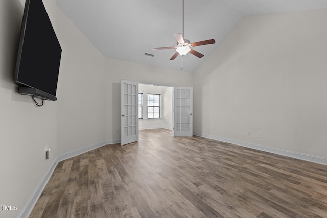 801 Socata Ln, Mebane, NC 27302 - unfurnished living room with ceiling fan, wood finished floors, french doors, and high vaulted ceiling