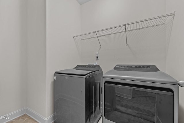 801 Socata Ln, Mebane, NC 27302 - laundry area with independent washer and dryer and light tile patterned floors