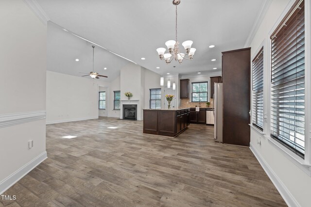801 Socata Ln, Mebane, NC 27302 - kitchen with dark brown cabinets, a chandelier, wood finished floors, freestanding refrigerator, and open floor plan