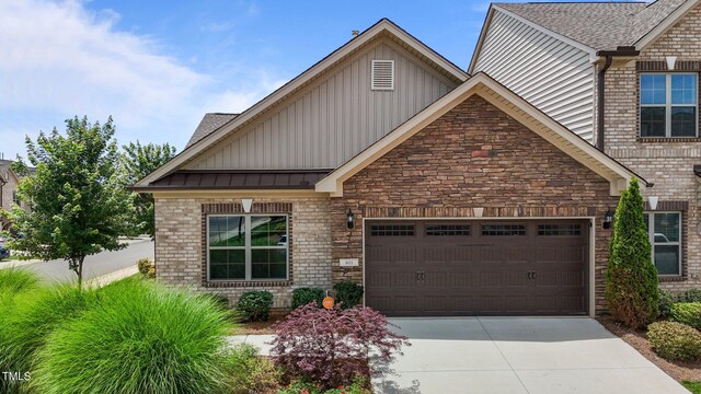 801 Socata Ln, Mebane, NC 27302 - craftsman inspired home featuring board and batten siding, an attached garage, concrete driveway, and brick siding