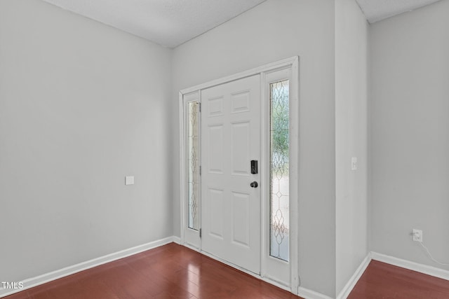 760 Stackhurst Way, Wake Forest, NC 27587 - entryway with dark wood-type flooring and baseboards