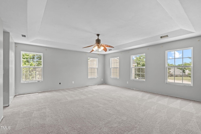 760 Stackhurst Way, Wake Forest, NC 27587 - carpeted empty room featuring a tray ceiling, plenty of natural light, and a ceiling fan