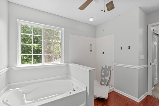 760 Stackhurst Way, Wake Forest, NC 27587 - bathroom with wood finished floors, a garden tub, and ceiling fan