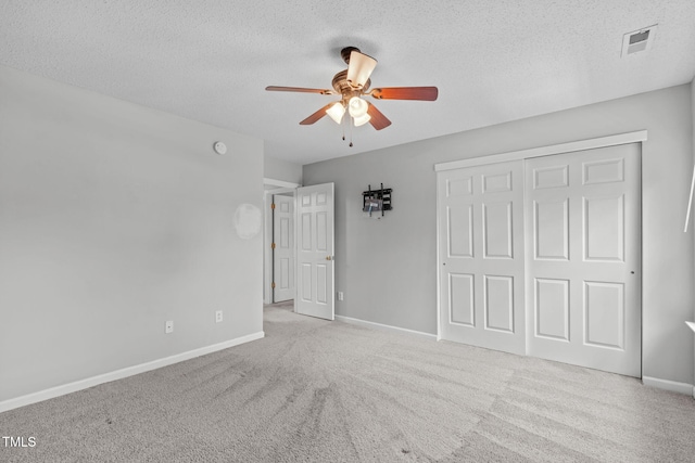 760 Stackhurst Way, Wake Forest, NC 27587 - unfurnished bedroom with carpet, a textured ceiling, a closet, and a ceiling fan