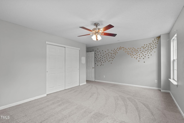 760 Stackhurst Way, Wake Forest, NC 27587 - unfurnished bedroom with multiple windows, a closet, carpet floors, and a textured ceiling