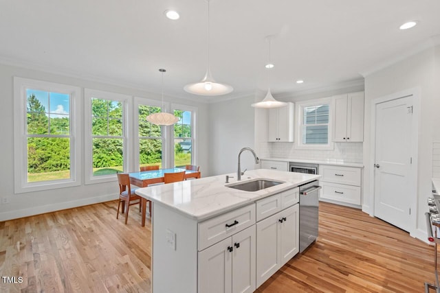 414 Wyndham Dr, Chapel Hill, NC 27516 - kitchen featuring stainless steel dishwasher, tasteful backsplash, ornamental molding, white cabinetry, and light wood finished floors