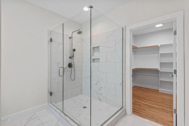 414 Wyndham Dr, Chapel Hill, NC 27516 - bathroom featuring a shower stall, marble finish floors, and a walk in closet