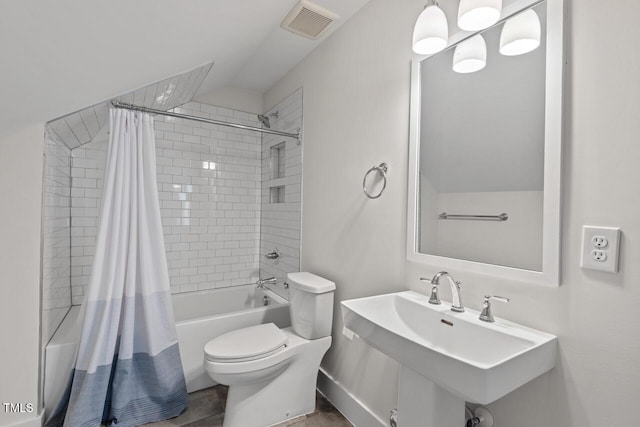 414 Wyndham Dr, Chapel Hill, NC 27516 - full bathroom with shower / bath combo with shower curtain and vaulted ceiling