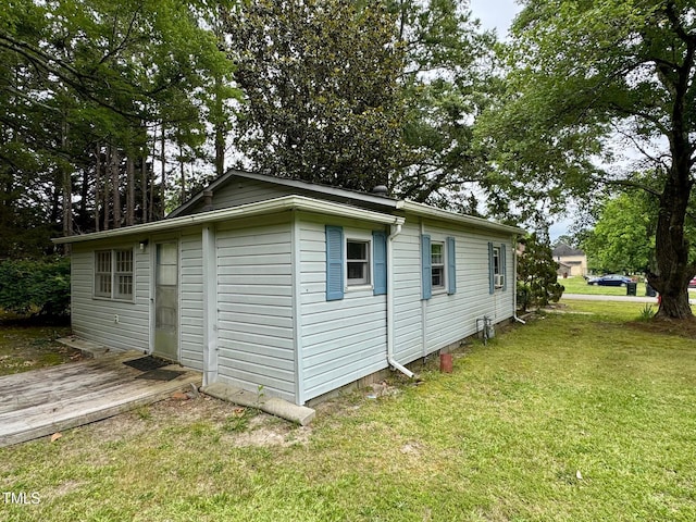 209 Rogers St, Norlina, NC 27563 - view of property exterior featuring a yard and a deck