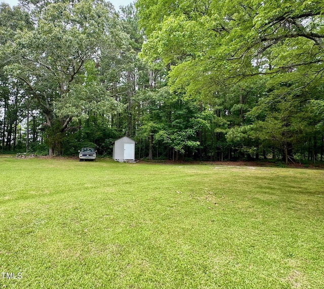 209 Rogers St, Norlina, NC 27563 - view of grassy yard featuring a shed