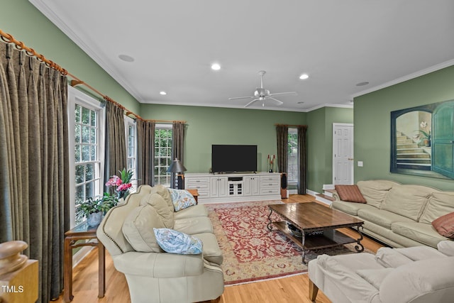8004 Gabriels Bend Dr, Raleigh, NC 27612 - living room with light wood finished floors, crown molding, recessed lighting, and a ceiling fan