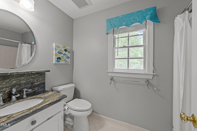 8004 Gabriels Bend Dr, Raleigh, NC 27612 - bathroom featuring vanity, a shower with curtain, and tile patterned flooring