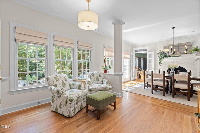 8004 Gabriels Bend Dr, Raleigh, NC 27612 - living area featuring decorative columns, wood finished floors, and ornamental molding