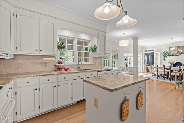 8004 Gabriels Bend Dr, Raleigh, NC 27612 - kitchen with white appliances, light wood finished floors, ornamental molding, and white cabinetry