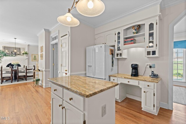 8004 Gabriels Bend Dr, Raleigh, NC 27612 - kitchen with white refrigerator with ice dispenser, light wood-style flooring, a kitchen island, white cabinets, and crown molding