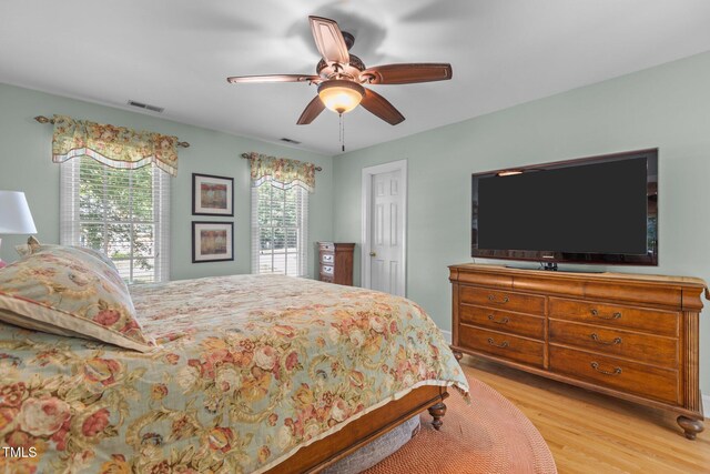 8004 Gabriels Bend Dr, Raleigh, NC 27612 - bedroom with wood finished floors and ceiling fan